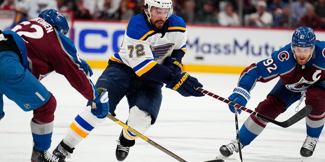St. Louis Blues defenseman Justin Faulk moves between Colorado Avalanche's Artturi Lehkonen and Gabriel Landeskog during the Stanley Cup playoff series Tuesday, May 17, 2022, in Denver.