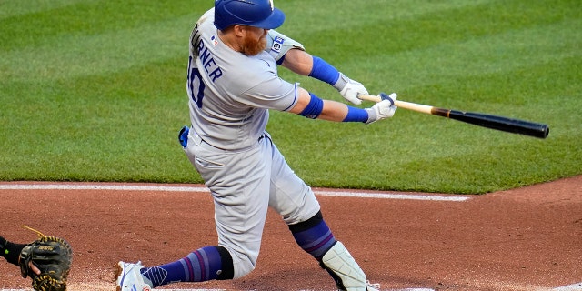 Los Angeles Dodgers' Justin Turner doubles off Pittsburgh Pirates starting pitcher Bryse Wilson, driving in two runs, during the third inning of a baseball game in Pittsburgh, Tuesday, May 10, 2022.