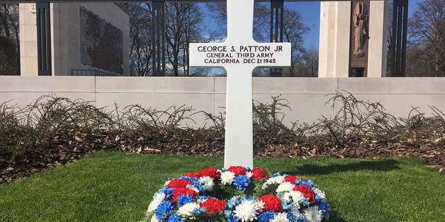 General George S. Patton's grave at the Luxembourg American Cemetery outside Luxembourg City stands on a singular plot facing rows and rows of the gravestones of American soldiers. 