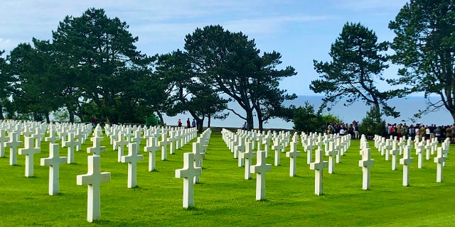 Gravestones at the Normandy American Cemetery in France stand in perfect alignment on a bluff overlooking the Atlantic Ocean. Many of the Americans buried here were killed on Omaha Beach, directly below, during the D-Day invasion on June 6, 1944. 