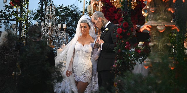 The 43-year-old lifestyle blogger wore Dolce &amp; Gabbana for the seaside nuptials to her musician husband.