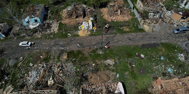 Destroyed houses are pictured in Vilhivka village near Kharkiv, Ukraine, on Thursday, May 11.
