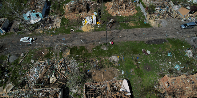 Destroyed houses are pictured in Vilhivka village near Kharkiv, Ukraine, on Thursday, May 11.