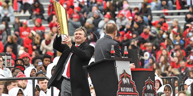 Georgia Bulldogs Head Coach Kirby Smart holds the College Football Playoff National Championship trophy during the Georgia Bulldogs National Championship Celebration on January 15, 2022 at Sanford Stadium in Athens, GA.