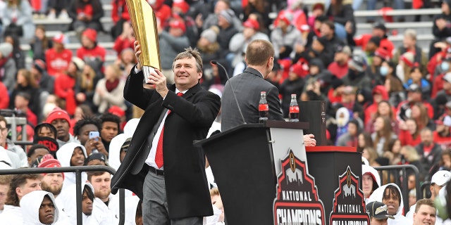 Georgia Bulldogs Head Coach Kirby Smart holds the College Football Playoff National Championship trophy during the Georgia Bulldogs National Championship Celebration on January 15, 2022 at Sanford Stadium in Athens, GA.