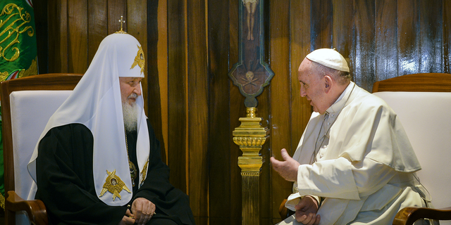 The head of the Russian Orthodox Church Patriarch Kirill, left, and Pope Francis talk during a meeting at the Jose Marti airport in Havana, Cuba, in February 2016.