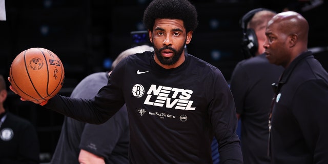 Kyrie Irving of the Brooklyn Nets warms up before a playoff game between the Brooklyn Nets and Boston Celtics at the Barclays Center in Brooklyn April 25, 2022.