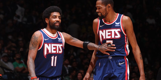 Kyrie Irving's absence from the Nets 'has been difficult for us to deal with,' says former assistant coach 2 Kyrie Irving (11) talks to Kevin Durant (7) of the Brooklyn Nets during Game 4 of the 2022 NBA Playoffs First Round on April 25, 2022, at the Barclays Center in Brooklyn.