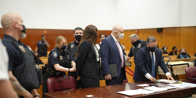 Lauren Pazienza, 26, is handcuffed and taken into custody May 10, 2022, after a judge ordered her held without bail in Manhattan Supreme Court.