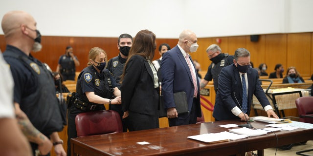 Lauren Pazienza, 26, is handcuffed and taken into custody May 10, 2022, after a judge ordered her held without bail in Manhattan Supreme Court.