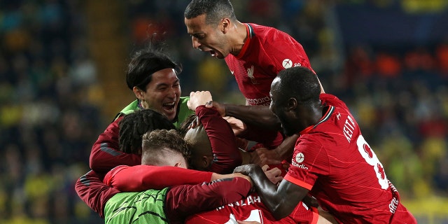 Liverpool's Fabinho celebrates with his teammates after scoring his side's opening goal during the Champions League semi final, second leg soccer match between Villarreal and Liverpool at the Ceramica stadium in Villarreal, Spain, Tuesday, May 3, 2022.