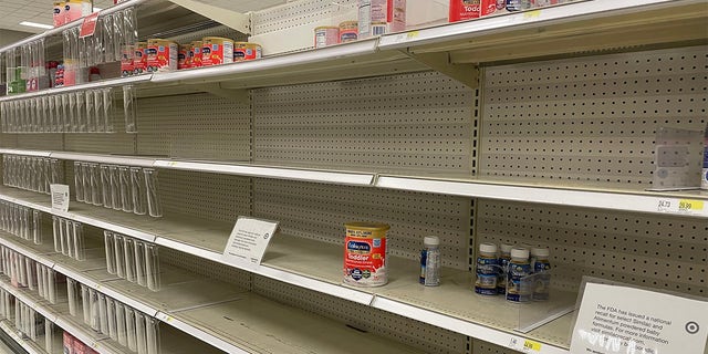 Empty formula shelves are shown in a Target store in Long Island, New York.