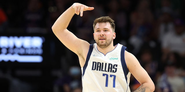Luca Doncic #77 of the Dallas Mavericks reacts after making a three point basket during the third quarter against the Phoenix Suns in Game Seven of the 2022 NBA Playoffs Western Conference Semifinals at Footprint Center on May 15, 2022 a Phoenix, Arizona. 