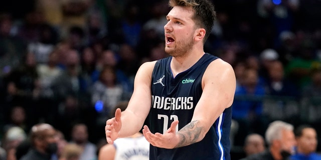 Dallas Mavericks guard Luka Doncic (77) reacts to a call during the second half against the Golden State Warriors in Game 3 of the NBA basketball playoffs Western Conference finals, Sunday, May 22, 2022, in Dallas. 