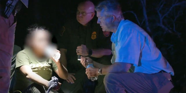 Sen. Roger Marshall gives aid to a distressed migrant at the southern border.