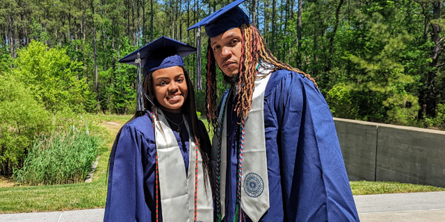 SaNayah Hill (left) and her dad, Marvin Fletcher (right), both graduated from Tidewater Community College on Monday, May 9, 2022, in Norfolk, Virginia.