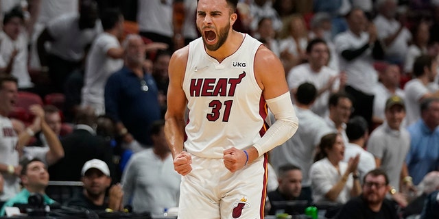 Miami Heat guard Max Strus (31) celebrates after scoring a three-point shot during the first half of Game 5 of an NBA basketball second-round playoff series against the Philadelphia 76ers, Tuesday, May 10, 2022, in Miami. 