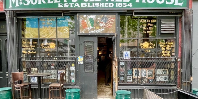 McSorley's on East 7th Street in lower Manhattan, founded in 1854, maintains its 19th-century ambiance amid steel-and-glass skyscrapers. 