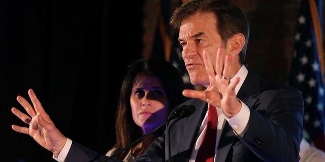 Mehmet Oz waves to supporters at a primary night election gathering in Newtown, Pennsylvania, Tuesday, May 17, 2022.