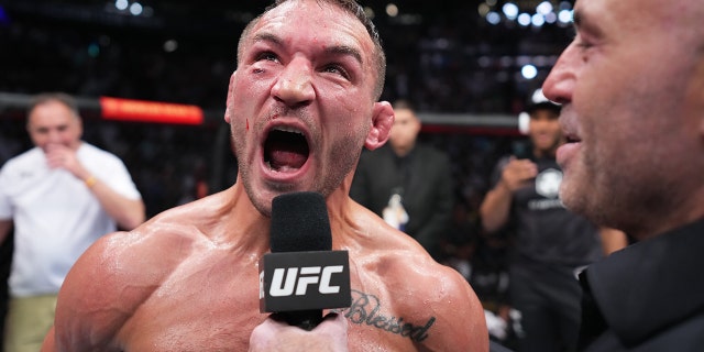 Michael Chandler celebrates after his knockout victory over Tony Ferguson at UFC 274 on May 7, 2022, in Phoenix, Arizona.