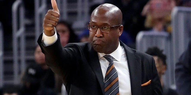 FILE - Golden State Warriors assistant coach Mike Brown gestures during an NBA basketball game against the Portland Trail Blazers in San Francisco, Nov. 4, 2019.