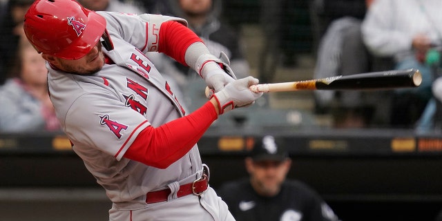 Los Angeles Angels' Mike Trout hits a solo home run during the first inning of a baseball game against the Chicago White Sox in Chicago, Sunday, May 1, 2022.