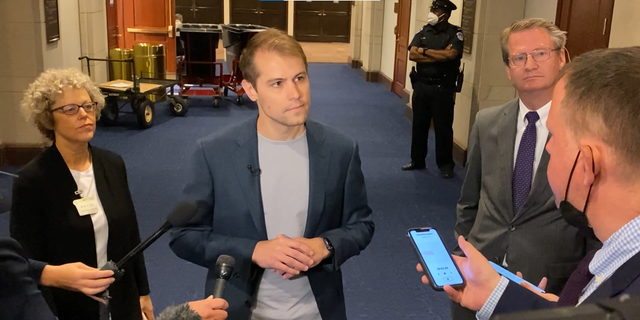 Former Navy fighter pilot Ryan Graves speaks to reporters after a House Intelligence subcommittee hearing on UFOs, officially called unidentified aerial phenomena, on May 17, 2022.