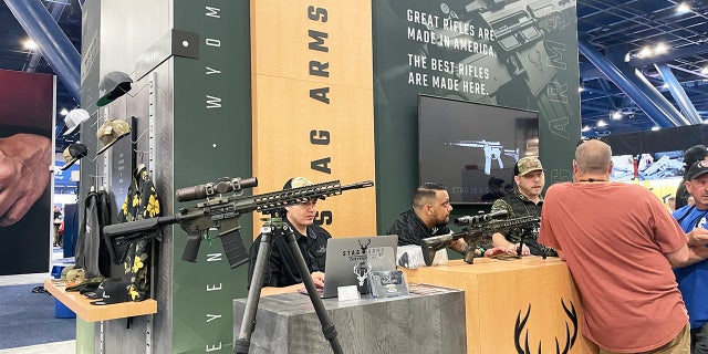 Different booths are shown on the exhibit floor of the 2022 NRA convention in Houston.