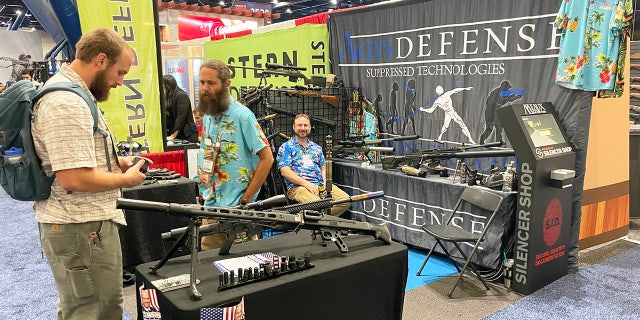 Different booths are shown on the exhibit floor of the 2022 NRA convention in Houston.