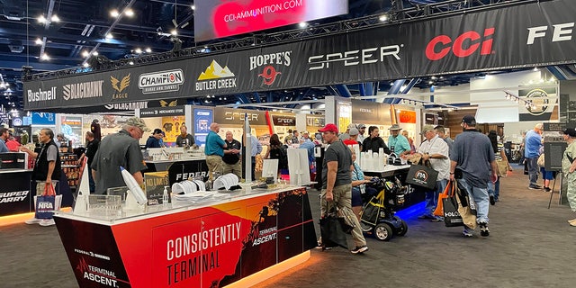 Different booths are shown on the exhibit floor of the 2022 NRA convention in Houston, Texas.