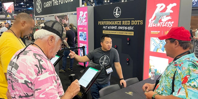 Different booths are shown on the exhibit floor of the 2022 NRA convention in Houston.