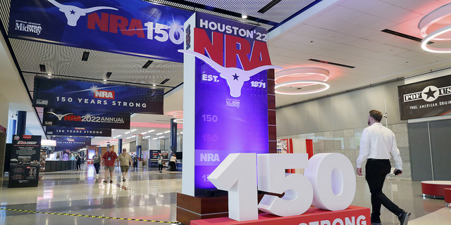 People attend the NRA's annual meeting at the George R. Brown Convention Center in Houston.