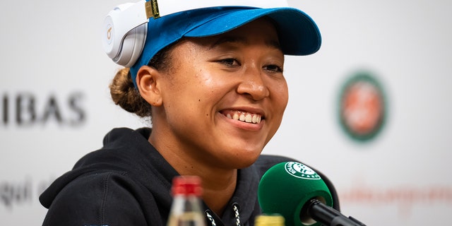 Naomi Osaka of Japan talks to the press during Media Day at Roland Garros May 20, 2022, in Paris.