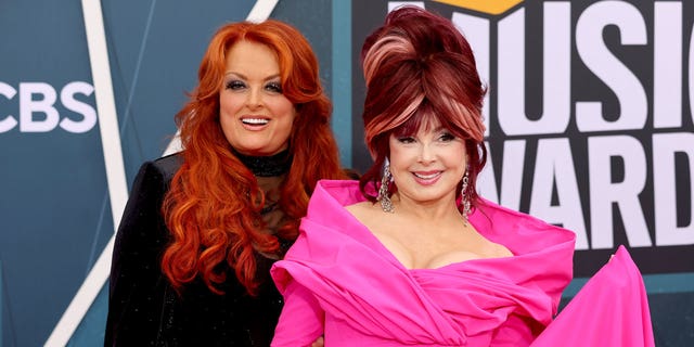 Wynonna Judd, left, appeared with her mother, Naomi Judd, at the CMT Awards on April 11, 2022.