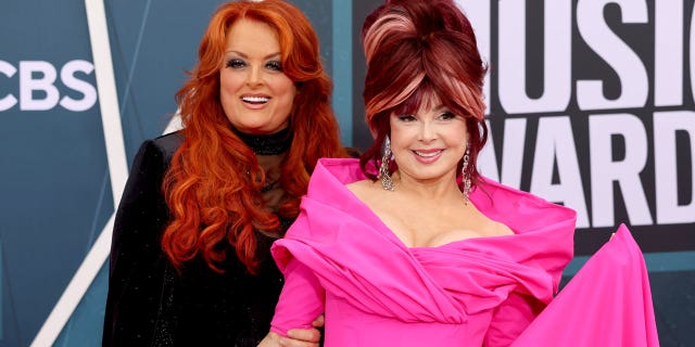 Wynonna Judd, left, appeared with her mother, Naomi Judd, at the CMT Awards on April 11, 2022.