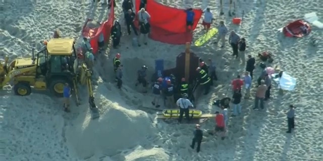 A teen digging on a New Jersey beach died Tuesday, and his younger sister was rescued after police say both out-of-towners became trapped beneath the sand when the hole collapsed on top of them. 