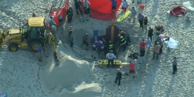 A teen digging on a New Jersey beach died Tuesday, and his younger sister was rescued after police say both out-of-towners became trapped beneath the sand when the hole collapsed on top of them. 