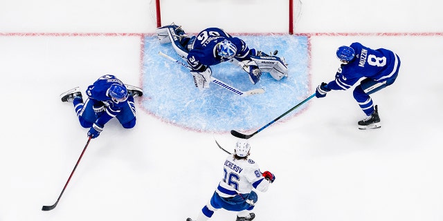 Jack Campbell of the Maple Leafs saves against Nikita Kucherov of the Tampa Bay Lightning during the first round of the 2022 Stanley Cup playoffs on May 10, 2022 in Toronto, Canada.