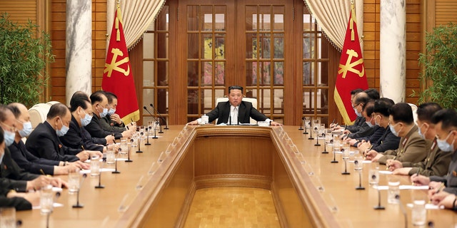 In this photo provided by the North Korean government, North Korean leader Kim Jong Un, center, attends a meeting of the Central Committee of the ruling Workers' Party in Pyongyang, North Korea Thursday, May 12, 2022. (Korean Central News Agency/Korea News Service via AP)