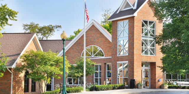 An American flag stands tall in front of the Old Worthington Library in Worthington, Ohio. (Worthington Libraries)