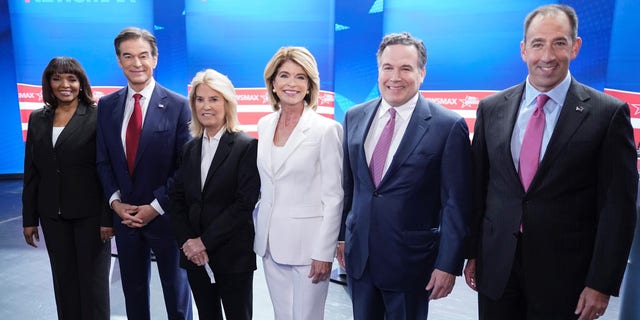 Kathy Barnette, Mehmet Oz, moderator Greta Van Susteren, Carla Sands, David McCormick, and Jeff Bartos, (left to right) pose for photo before they take part in a debate for Pennsylvania U.S. Senate Republican candidates, Wednesday, May 4, 2022, in Grove City, Pa. 