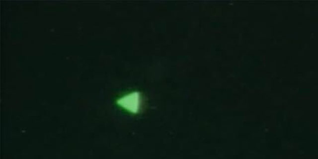 The Department of Defense recently released images of this UFO, a glowing green triangle in the night sky. 