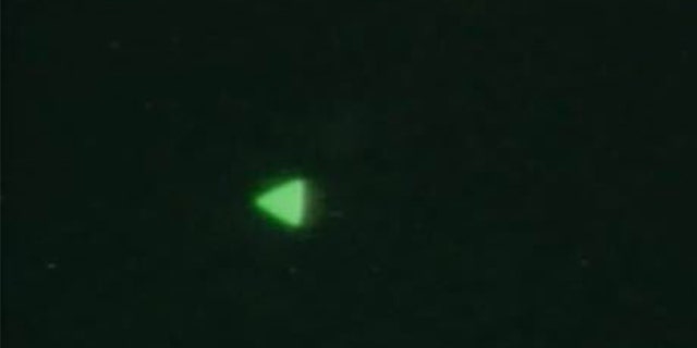 The Department of Defense recently released images of this UFO, a glowing green triangle in the night sky. 