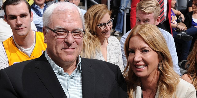 Phil Jackson, then-president of the New York Knicks, and Jeanie Buss, president of the Lakers, pose for a photo at Staples Center on March 12, 2015, in Los Angeles, California.