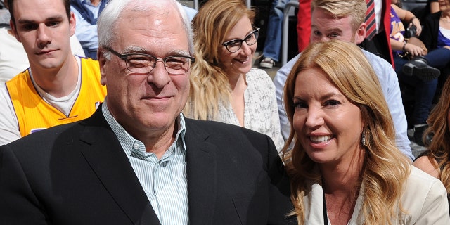 Phil Jackson, then-president of the New York Knicks, and Jeanie Buss, president of the Lakers, pose for a photo at Staples Center on March 12, 2015, in Los Angeles, California.