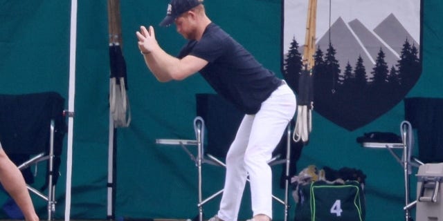 Prince Harry enjoys a deep stretch before a polo match in Santa Barbra.