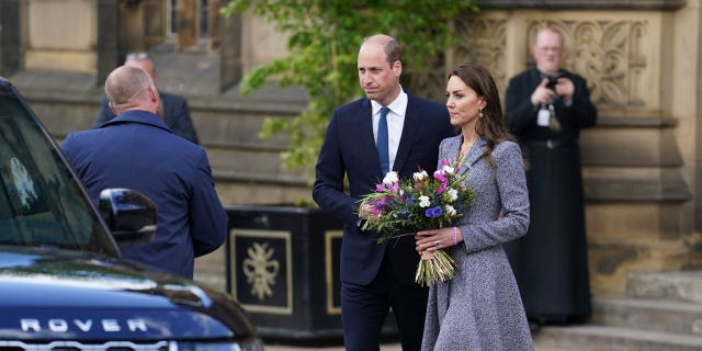 William and the Duchess of Cambridge leave after attending the launch of the Glade of Light Memorial, outside Manchester Cathedral.