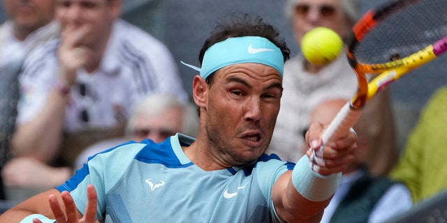 Rafael Nadal returns from injury with straight-set win in Madrid