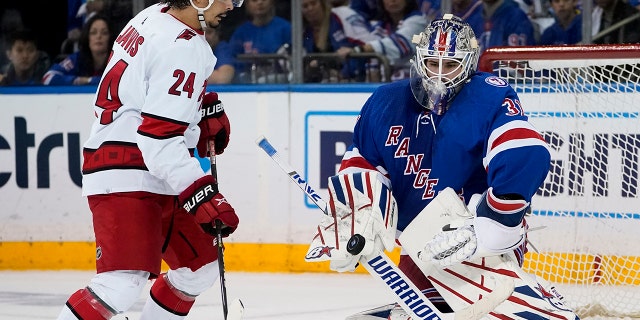 New York Rangers goaltender Igor Shesterkin (31) makes a save against Carolina Hurricanes center Seth Jarvis (24) during the second period of Game 6 of an NHL hockey Stanley Cup second-round playoff series, Saturday, May 28, 2022, in New York. (AP Photo/John Minchillo)