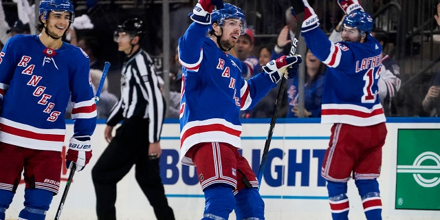 New York Rangers center Filip Chytil (72) celebrates after scoring on Carolina Hurricanes goaltender Antti Raanta during the second period of Game 6 of an NHL hockey Stanley Cup second-round playoff series, Saturday, May 28, 2022, in New York. (AP Photo/John Minchillo)